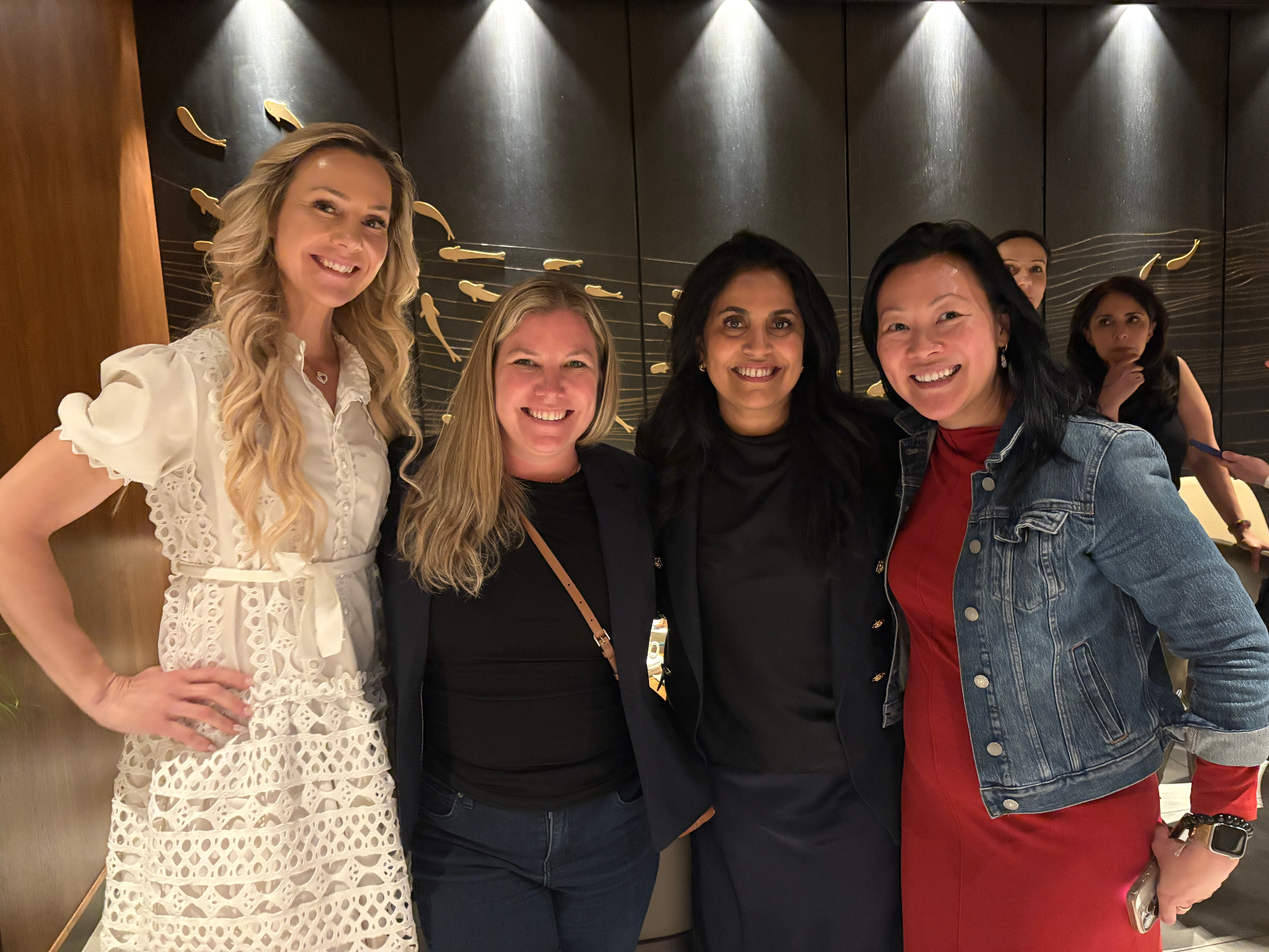 Four guests posing together at the Toronto edition