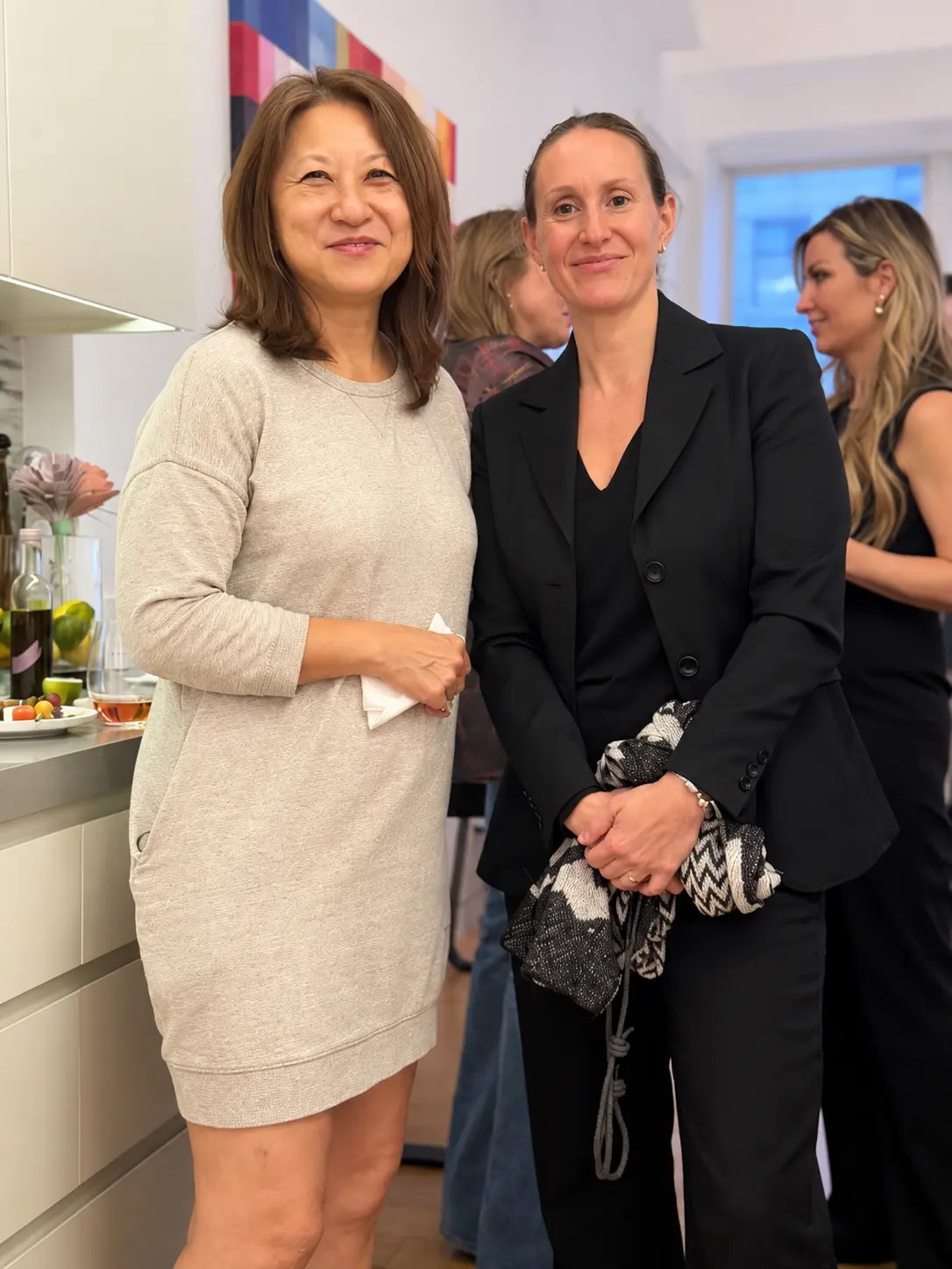 Two guests posing together at Rosé at the Helm