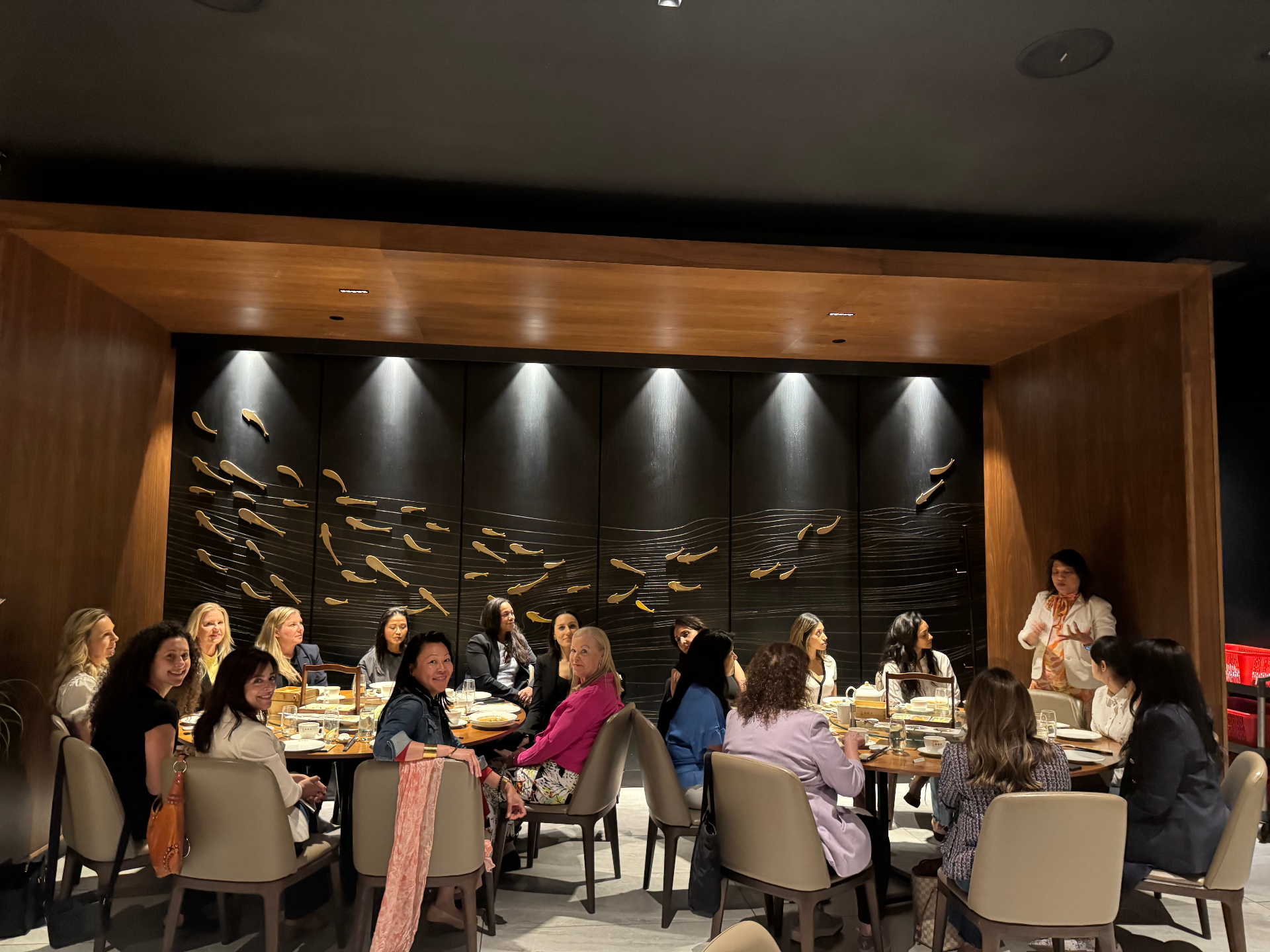 Guests gathered around the table during the Toronto lunch