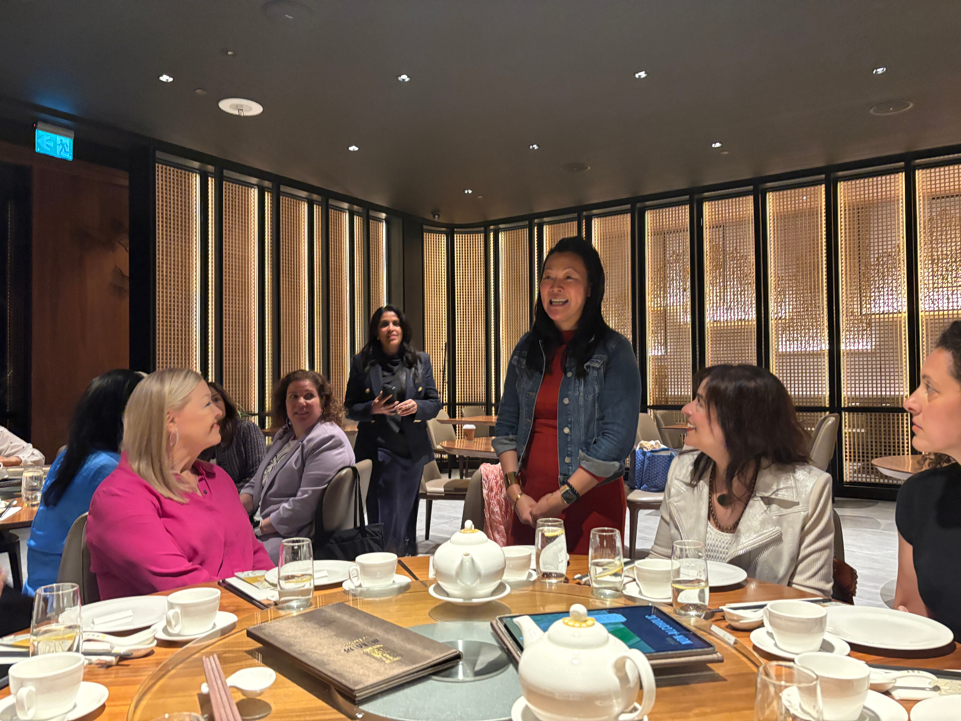 Host speaking to guests at the Toronto lunch