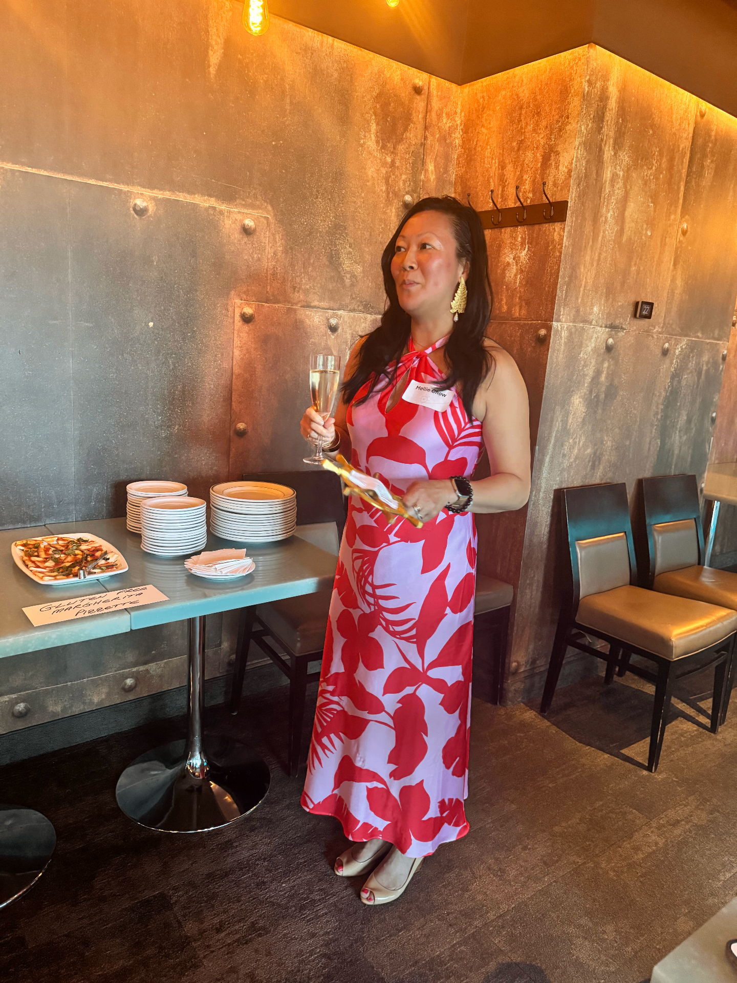 Mellie in a red and pink dress at the Toronto Summer '26 venue