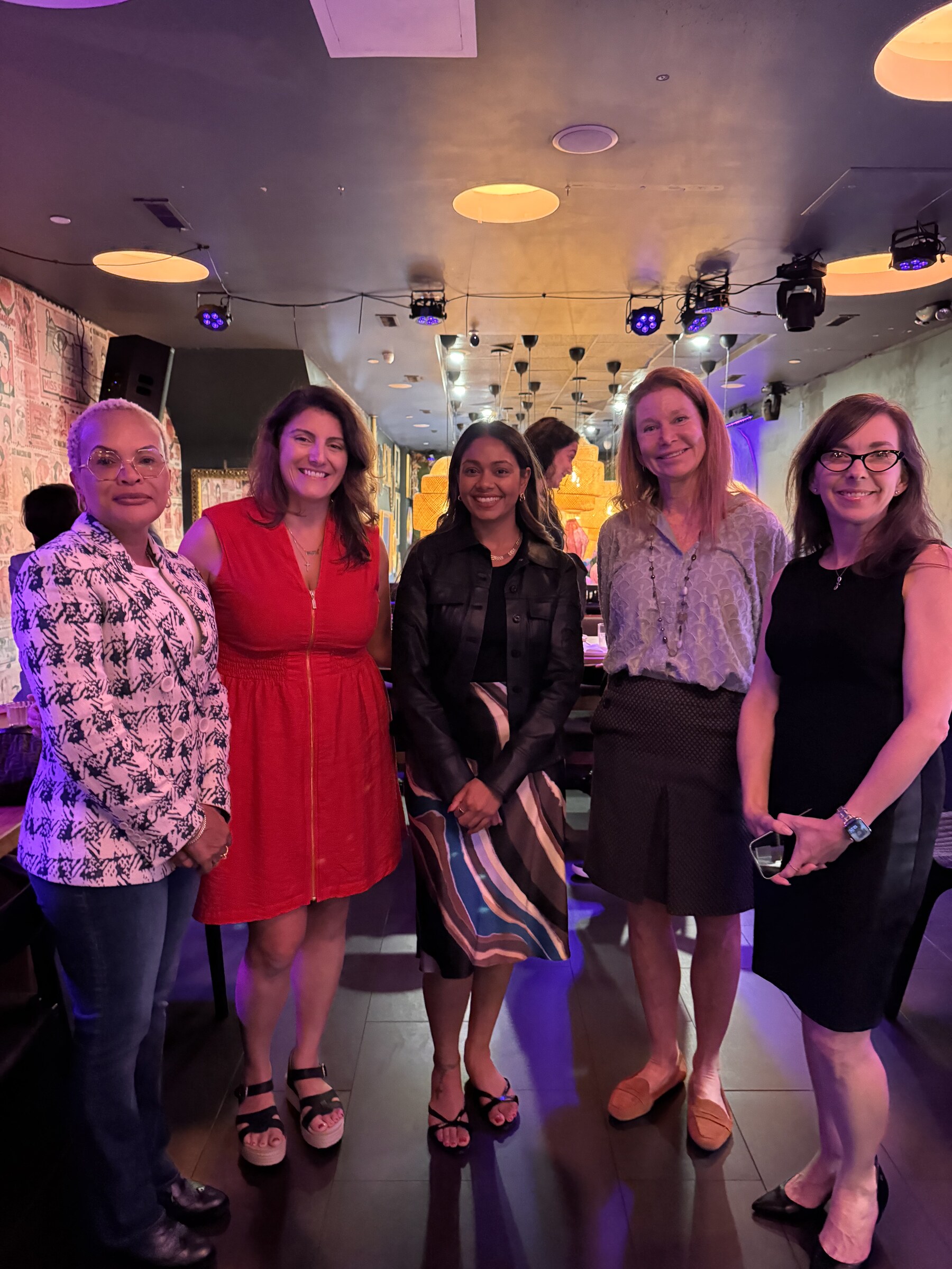 Five guests posing together at the Philadelphia gathering