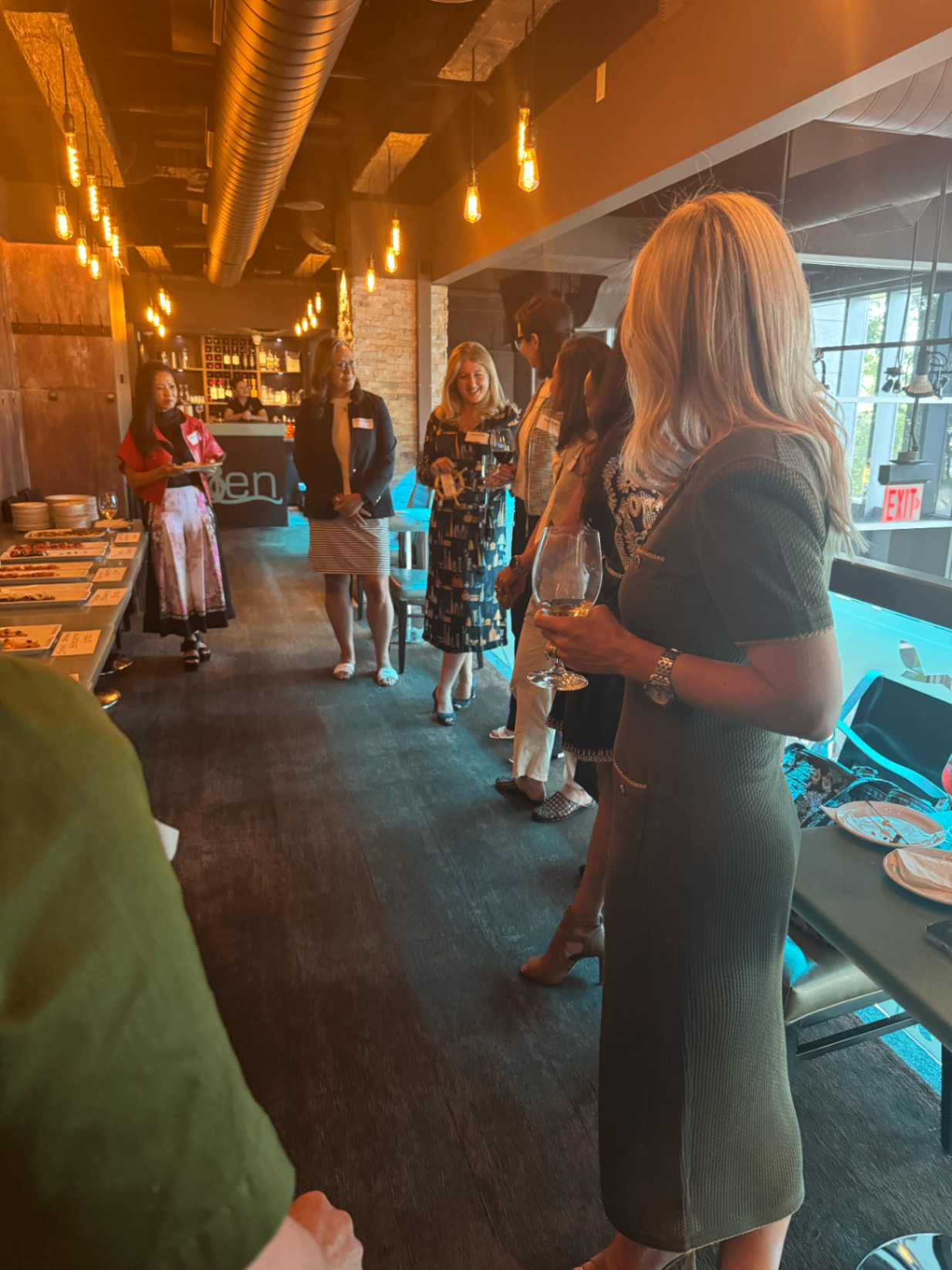 Attendees mingling by the bar at Toronto Summer '26